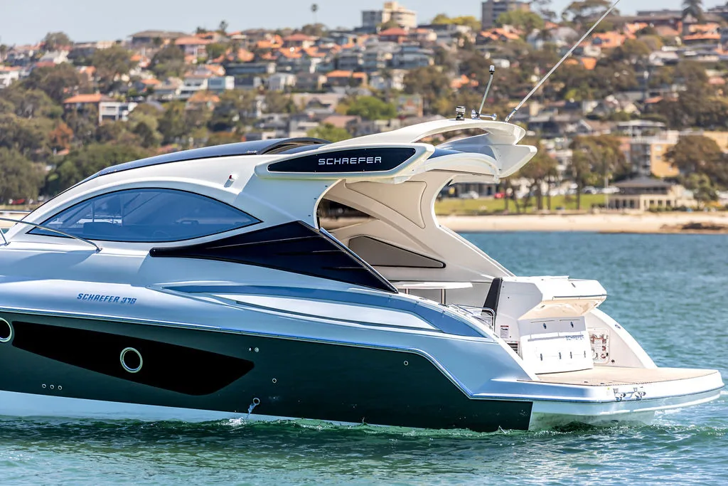 Schaefer 375 HT running past Sydney waterfront homes