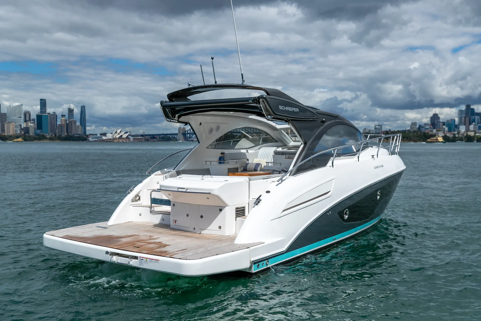 Stern view of the Schaefer 400 with the swim platform and Sydney skyline