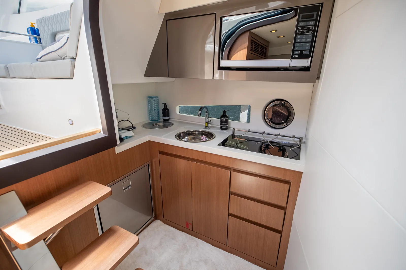Galley of the Schaefer 400 with timber cabinetry