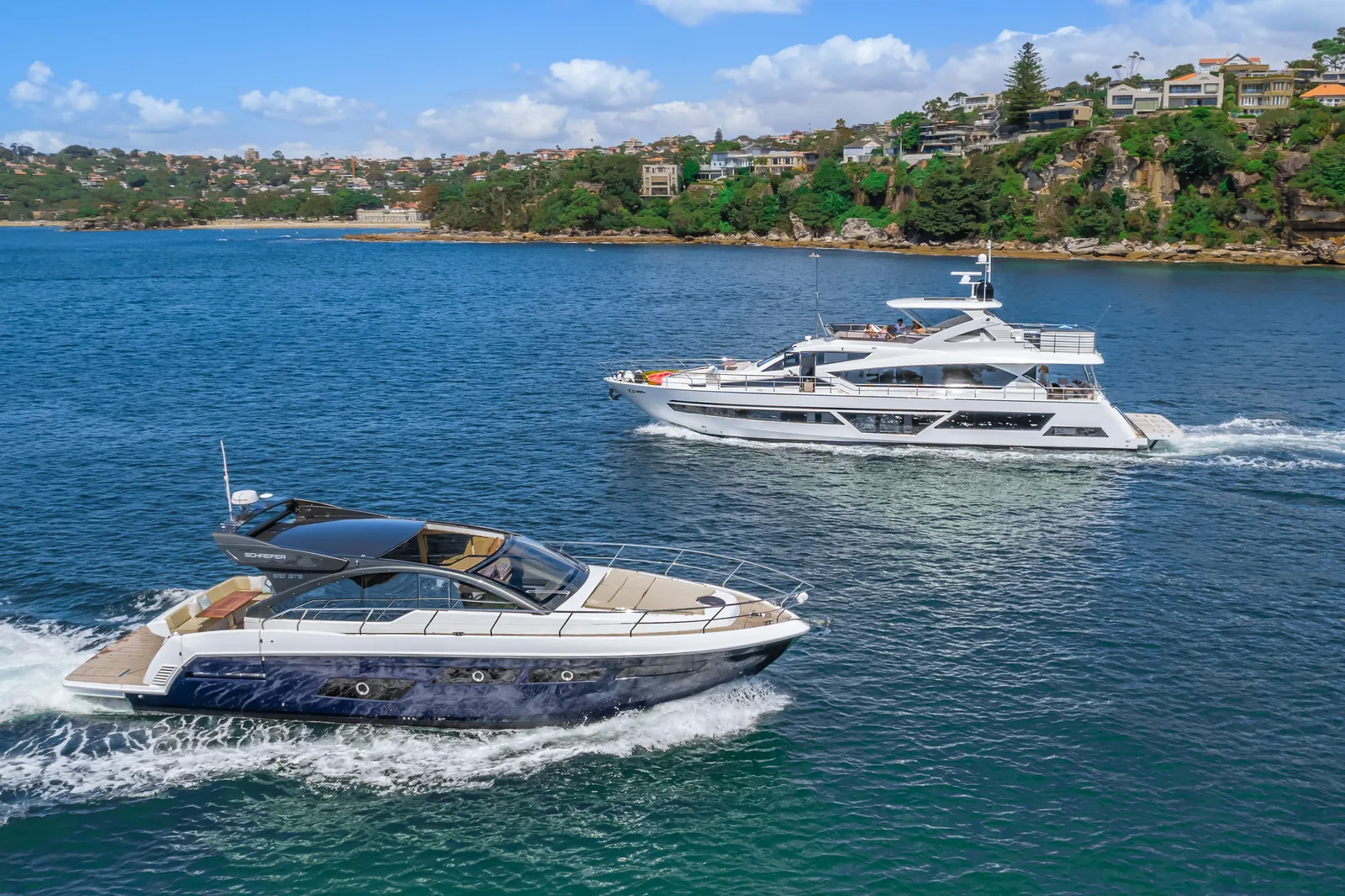 Schaefer 510 GTS passing a superyacht on the harbour