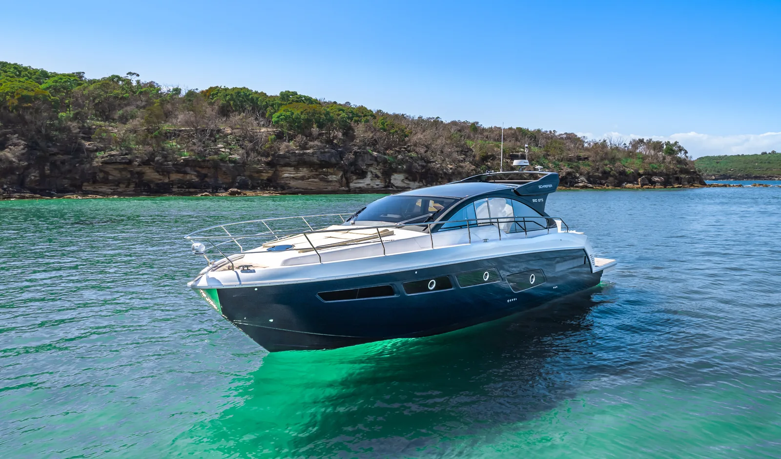 Schaefer 510 GTS at anchor in a sandstone cove