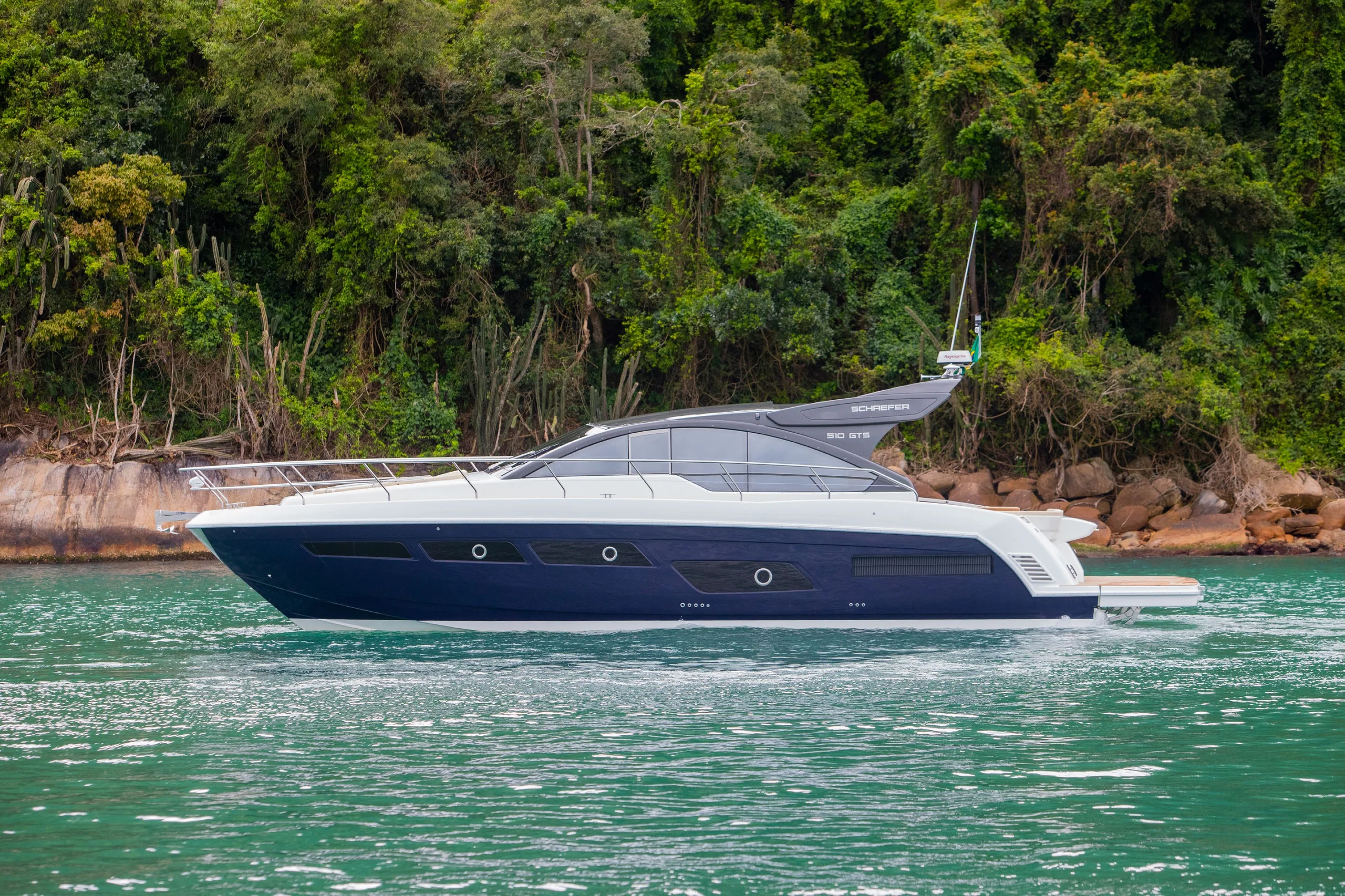 Schaefer 510 GTS at anchor below a forested hillside