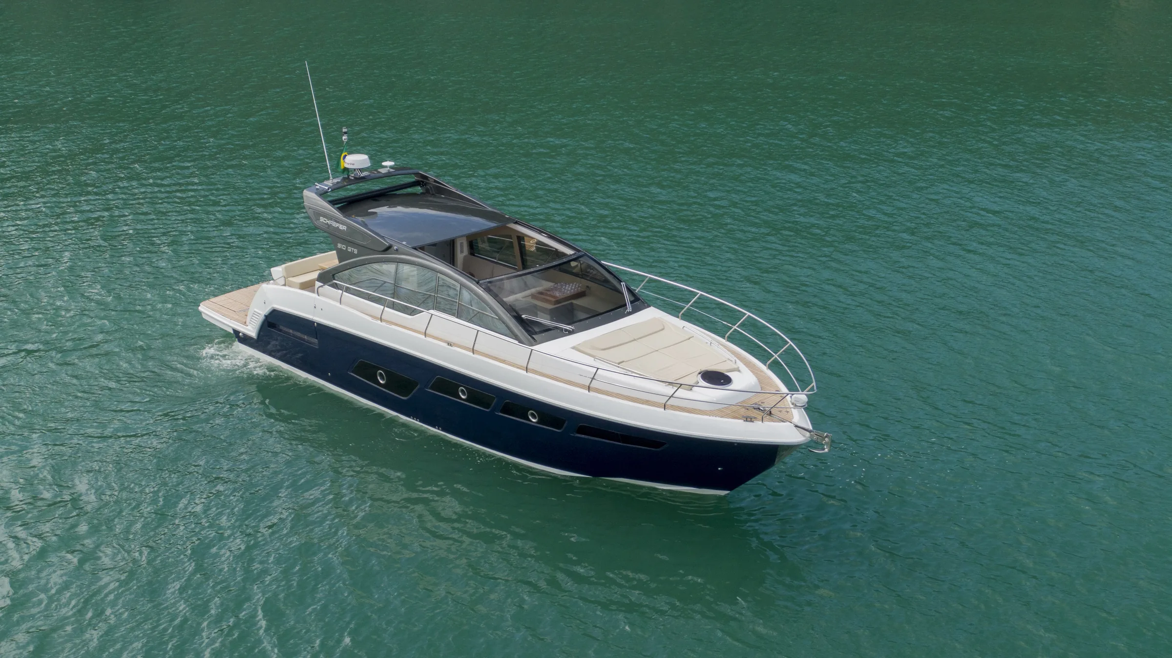 Schaefer 510 GTS at anchor in calm green water