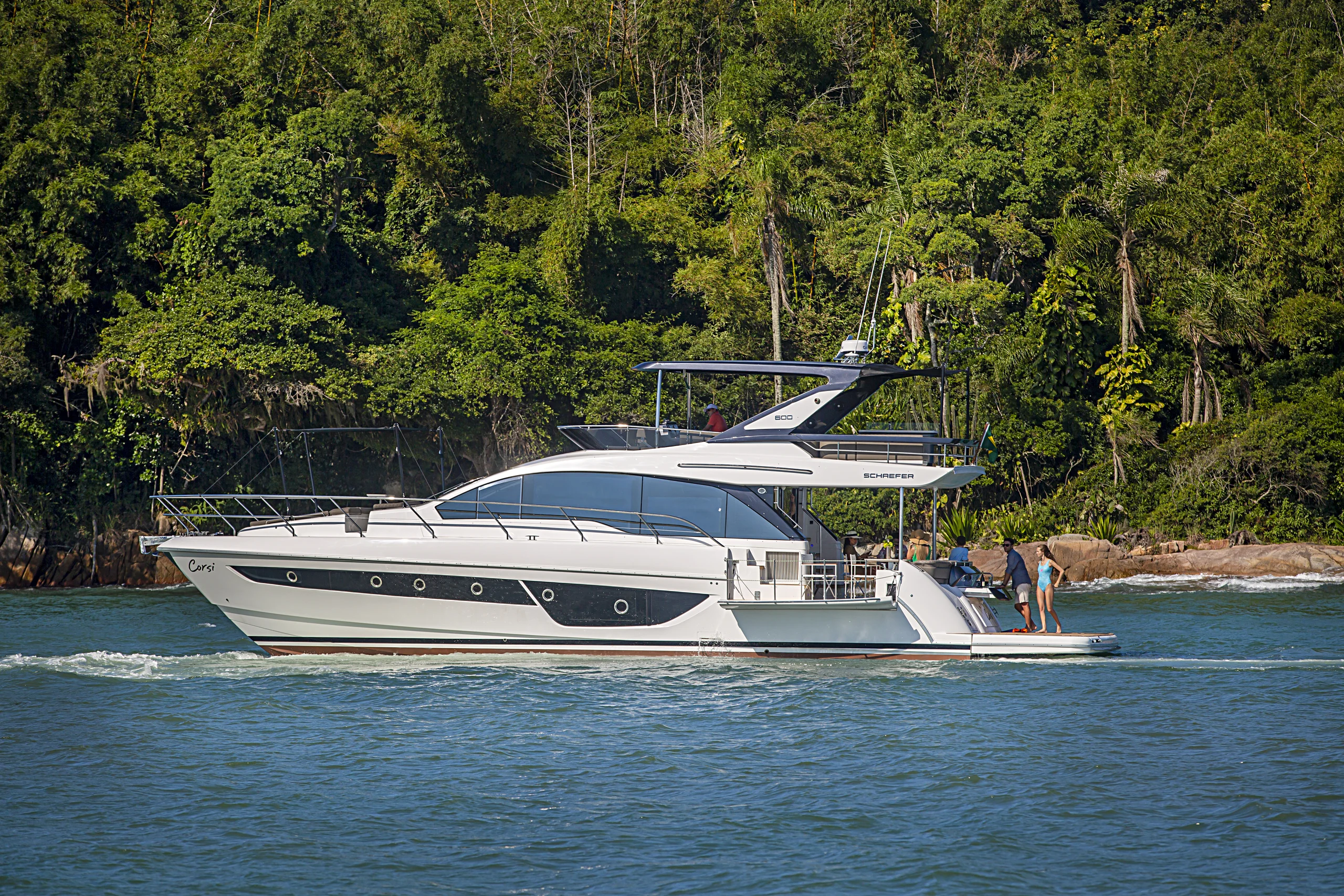 Schaefer 600 at anchor with guests on the swim platform