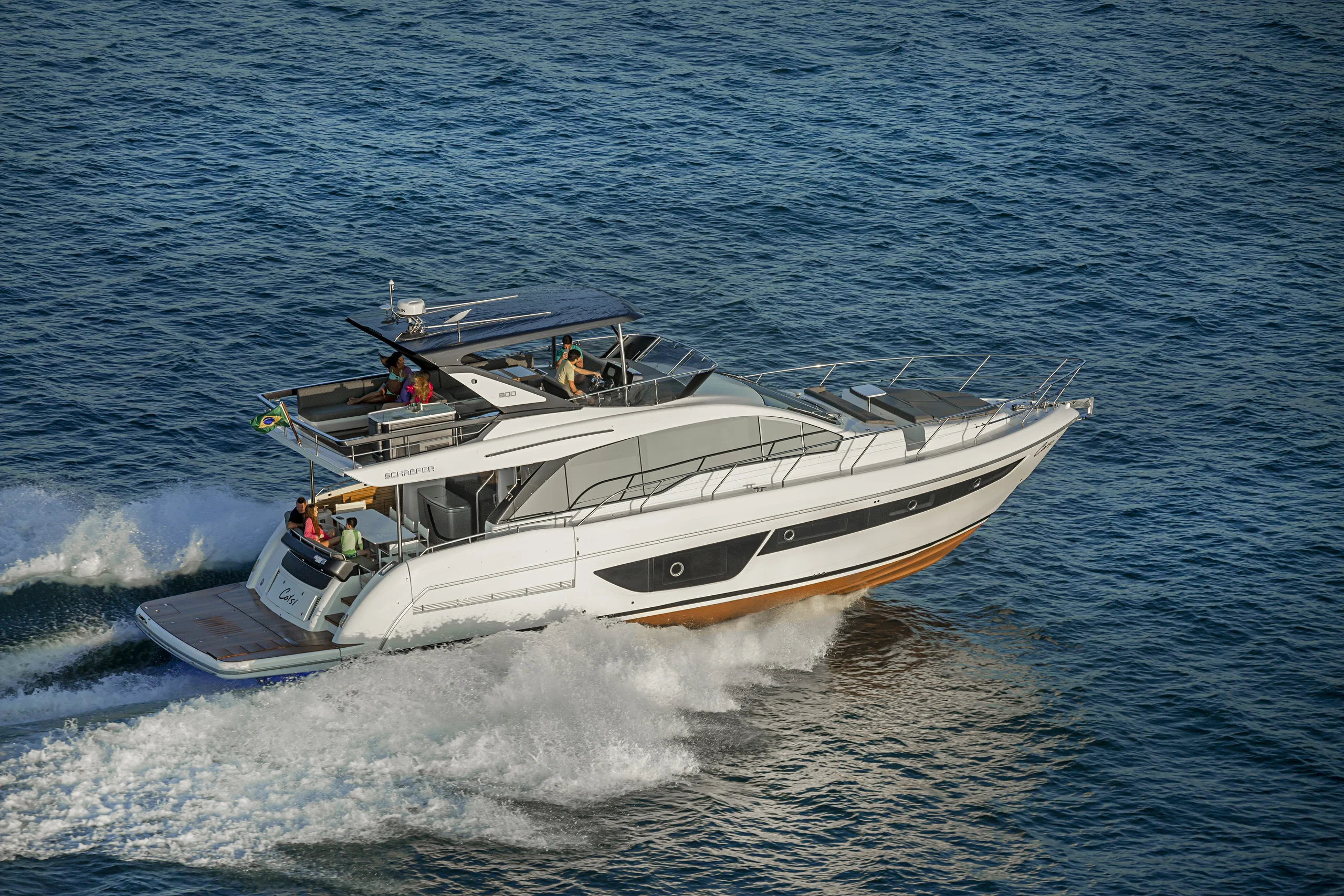 Schaefer 600 under way with guests on the flybridge