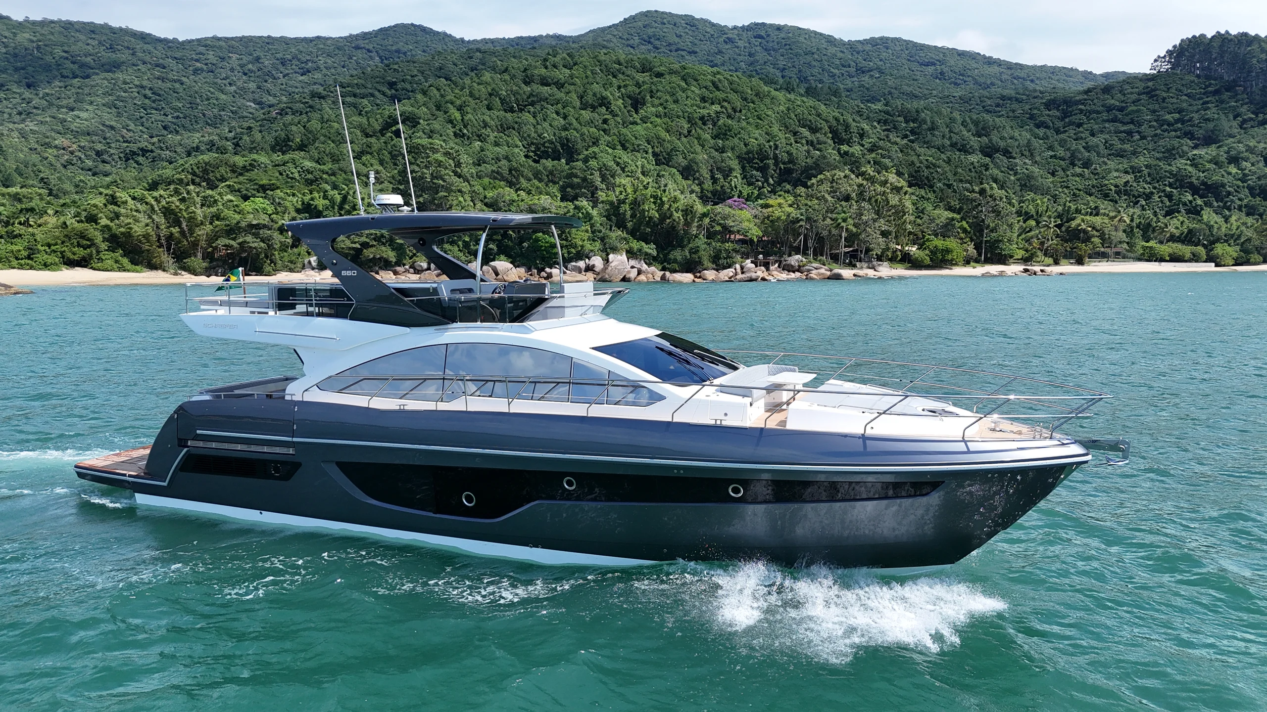Schaefer 660 off a beach, stern quarter view