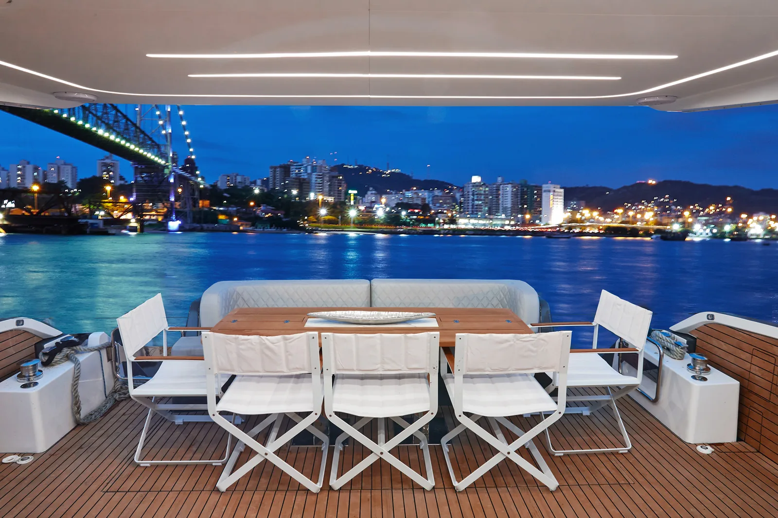 Cockpit dining on the Schaefer 660 at night with city lights behind