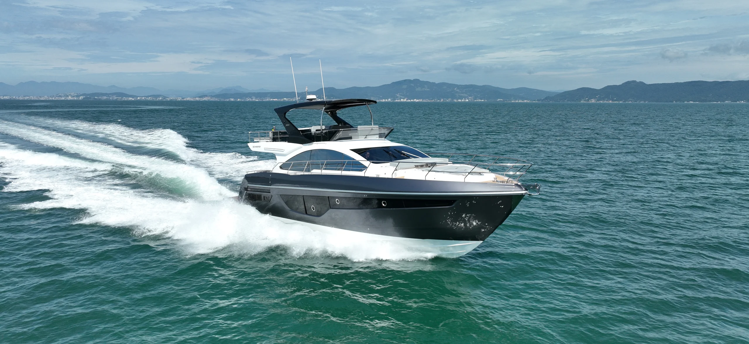 Schaefer 660 running at speed across a wide bay