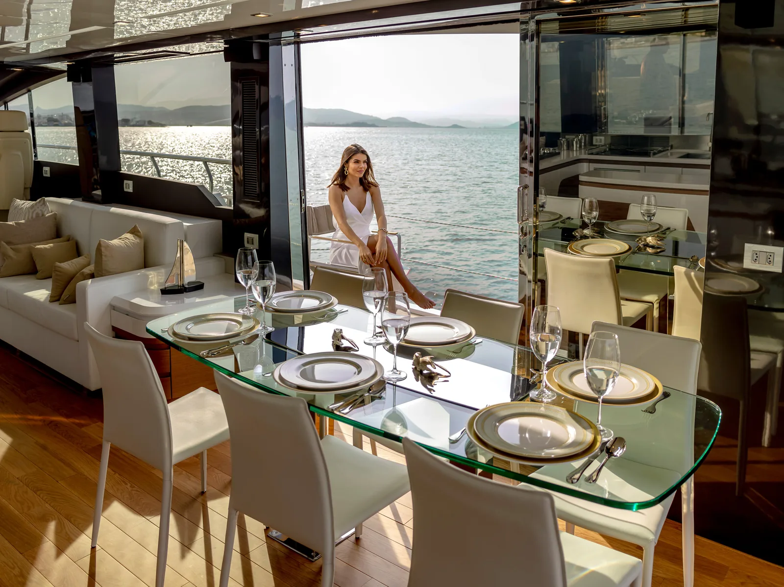 Dining table set beside the saloon windows on the Schaefer 770