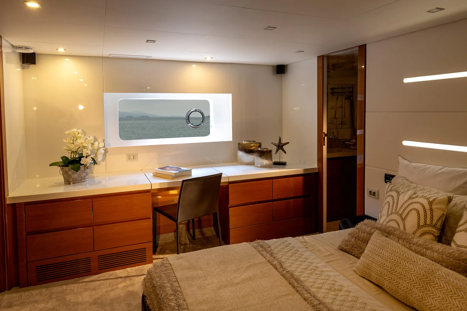 Master cabin of the Schaefer 770 with vanity and hull window