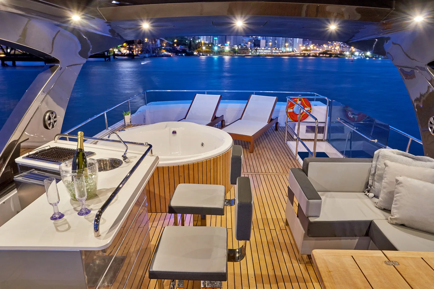 Schaefer 770 flybridge at dusk with bar, lounge and command station