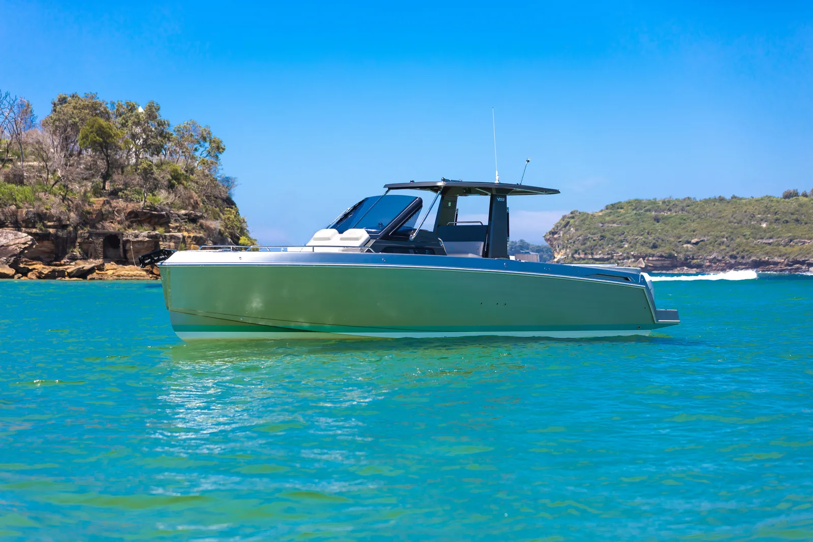 Schaefer V33 cruising past a bushland headland