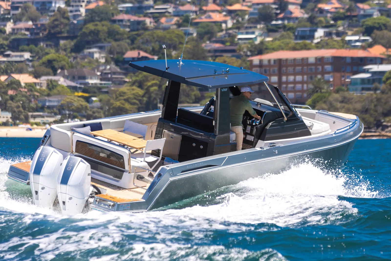 Schaefer V33 turning at speed past waterfront homes