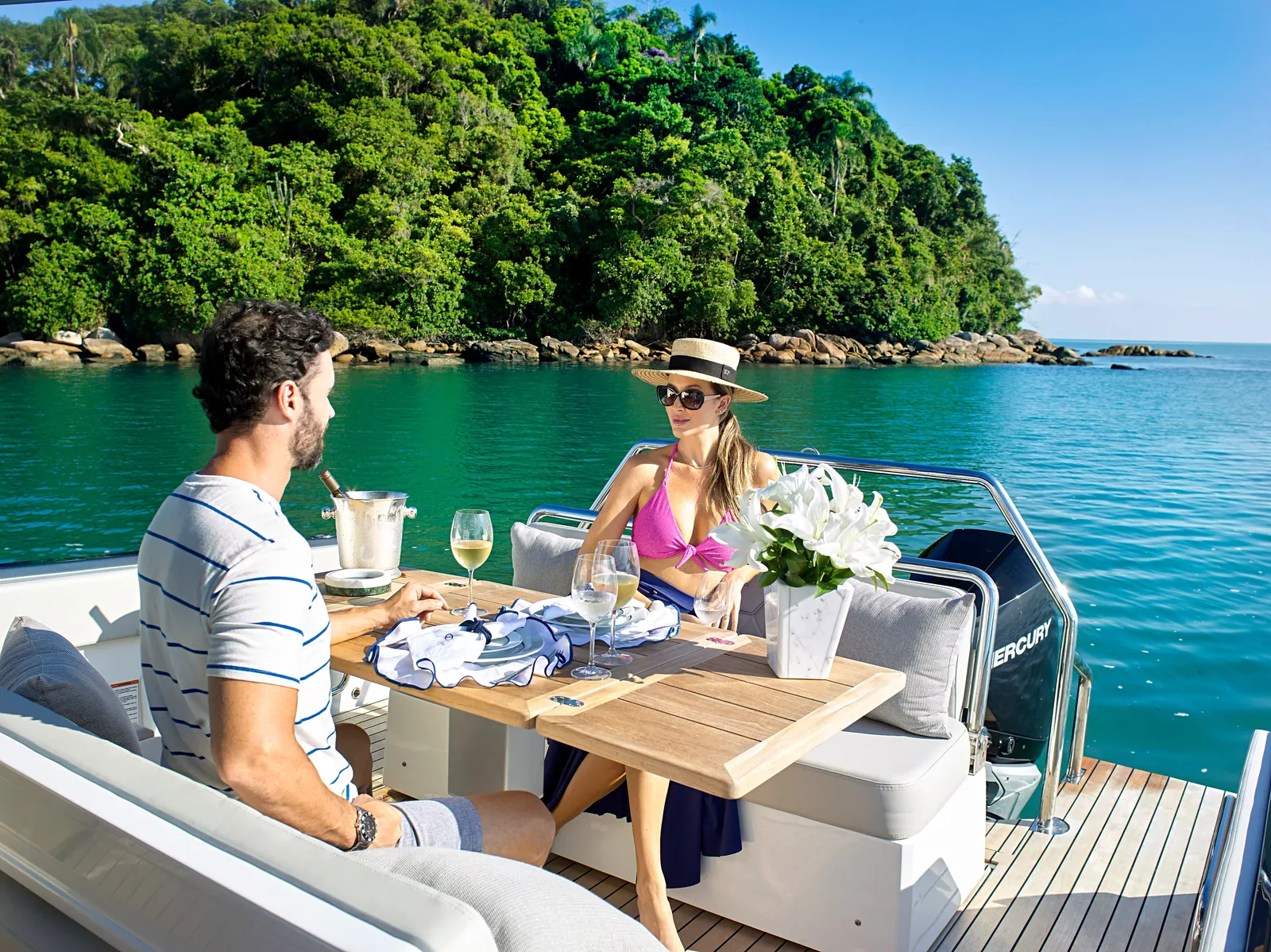 Couple dining at the aft table of the Schaefer V34