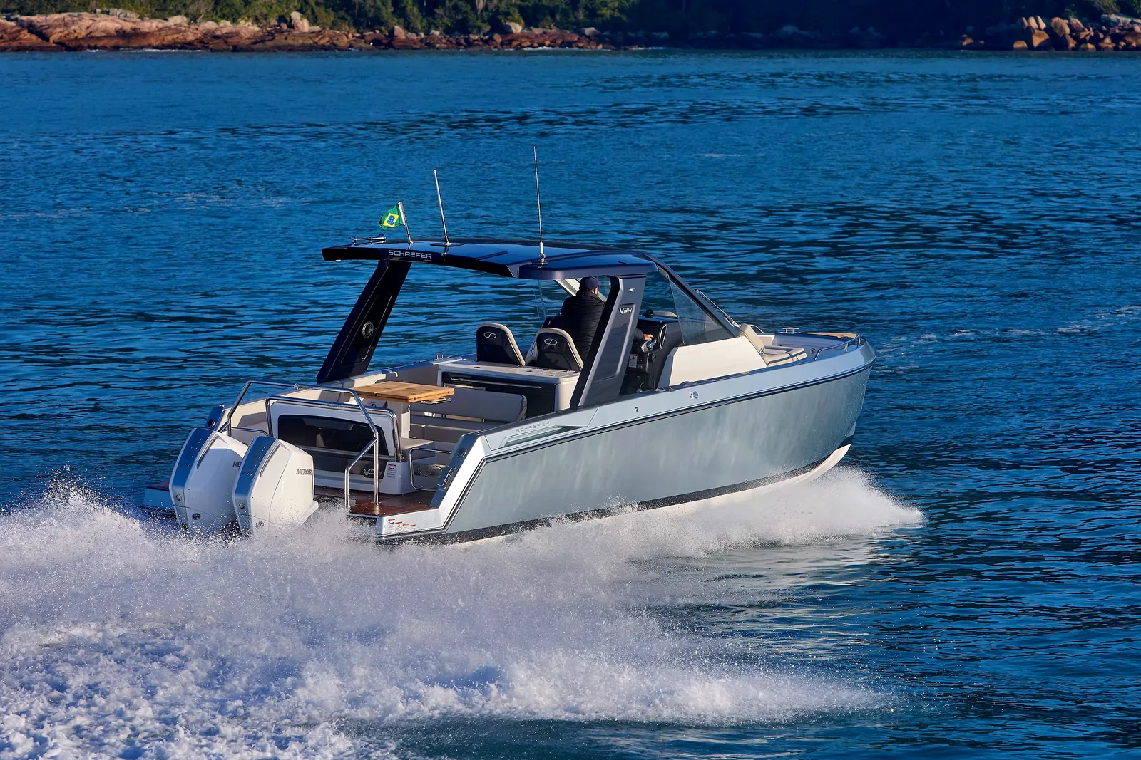 Schaefer V34 at speed across a sheltered bay