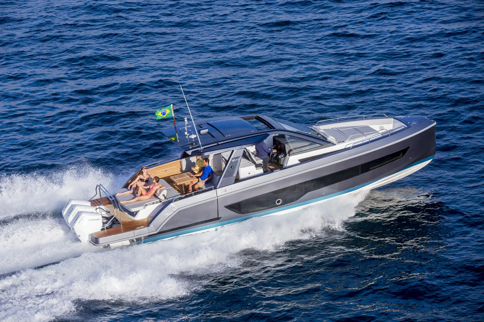 Schaefer V44 with triple outboards at speed, aerial view