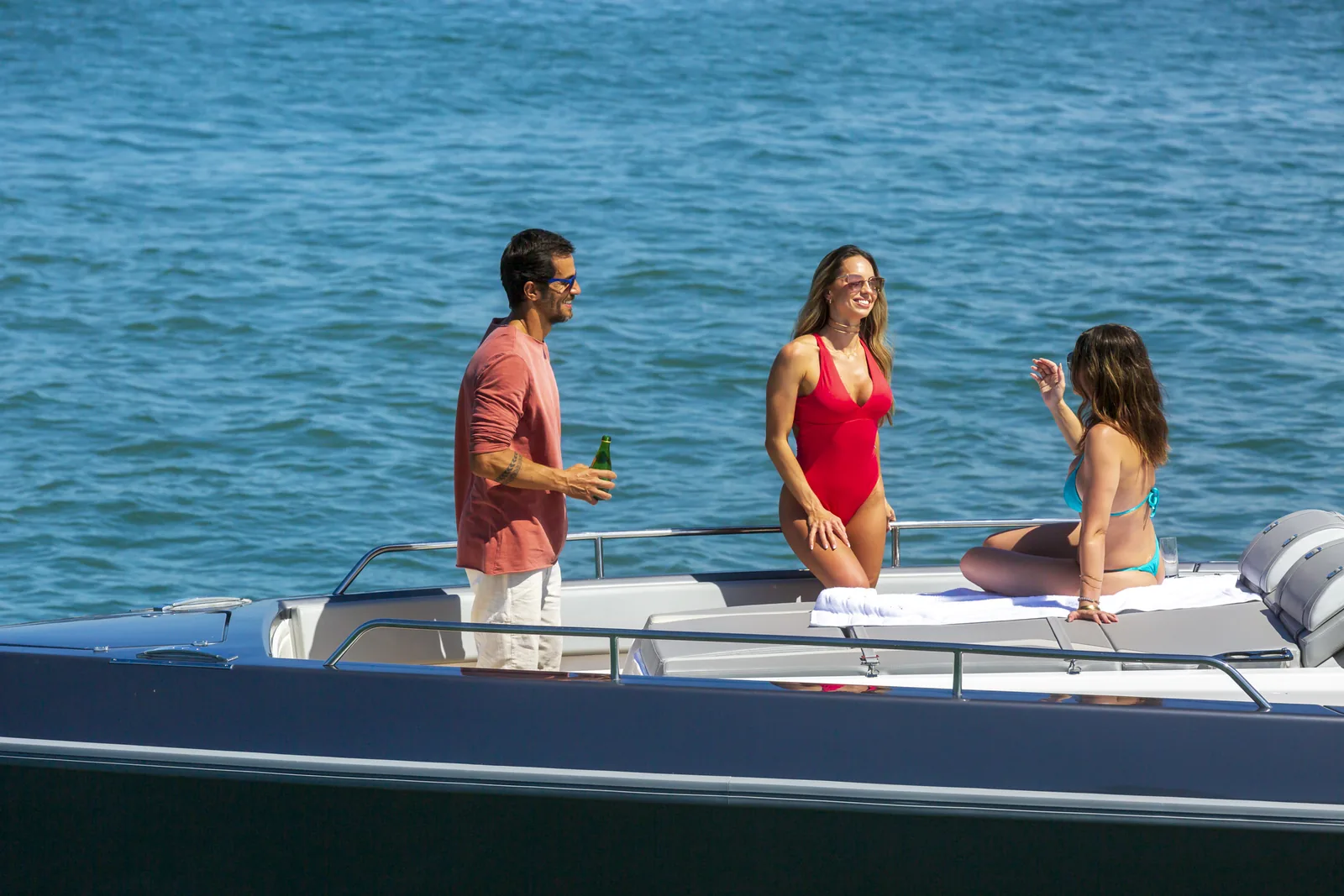 Guests on the expanded deck of the Schaefer V44 at anchor