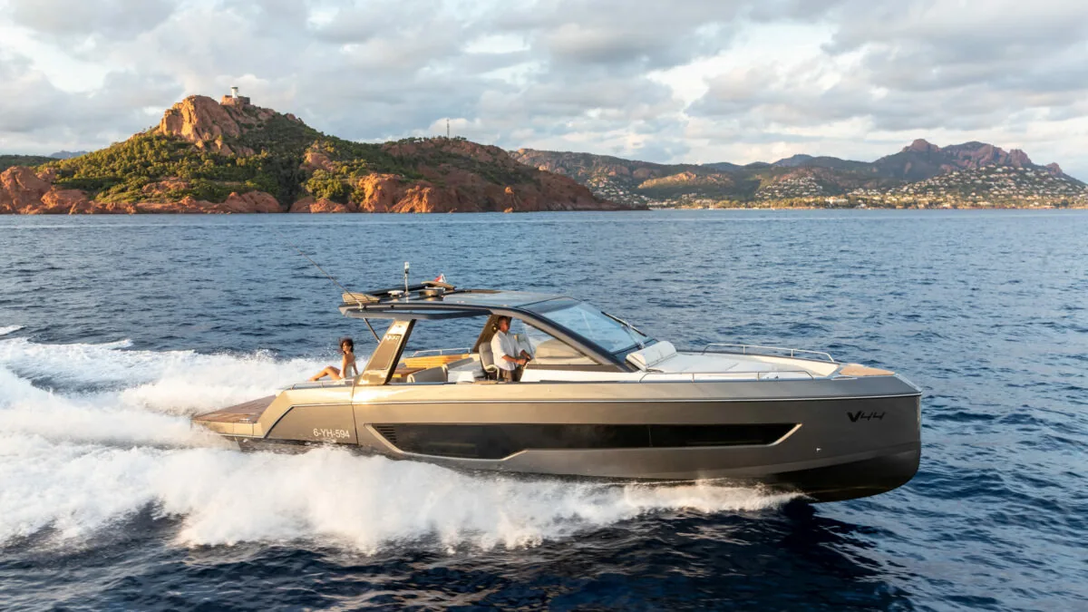 Schaefer V44 cruising past red cliffs on the Mediterranean coast