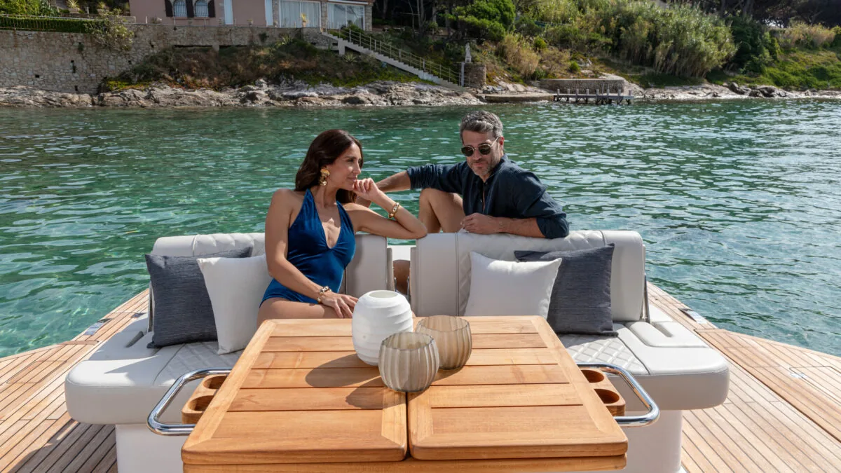 Couple dining at the aft table of the Schaefer V44