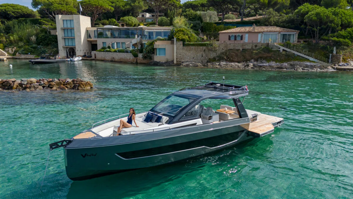 Schaefer V44 at anchor in a turquoise cove with a balcony open
