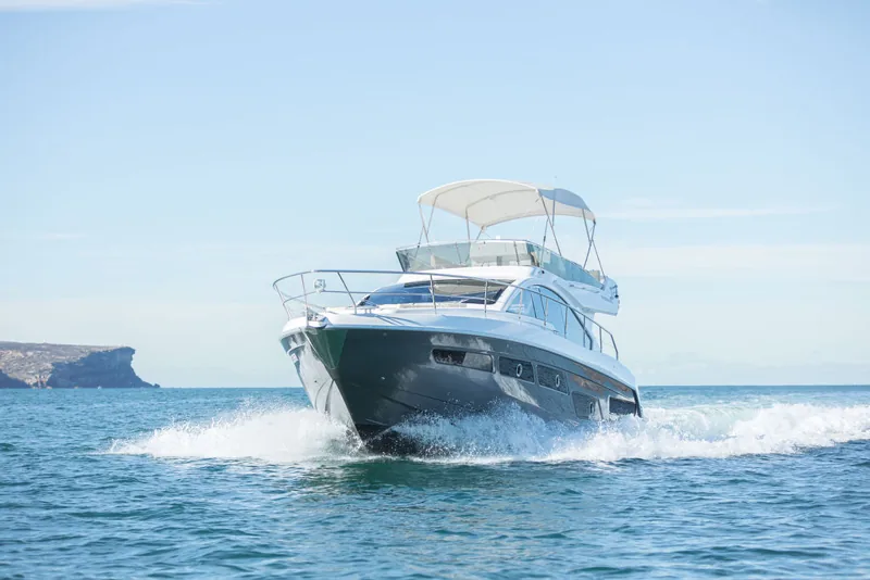 Schaefer 510 GT flybridge running towards the camera off the Sydney coast